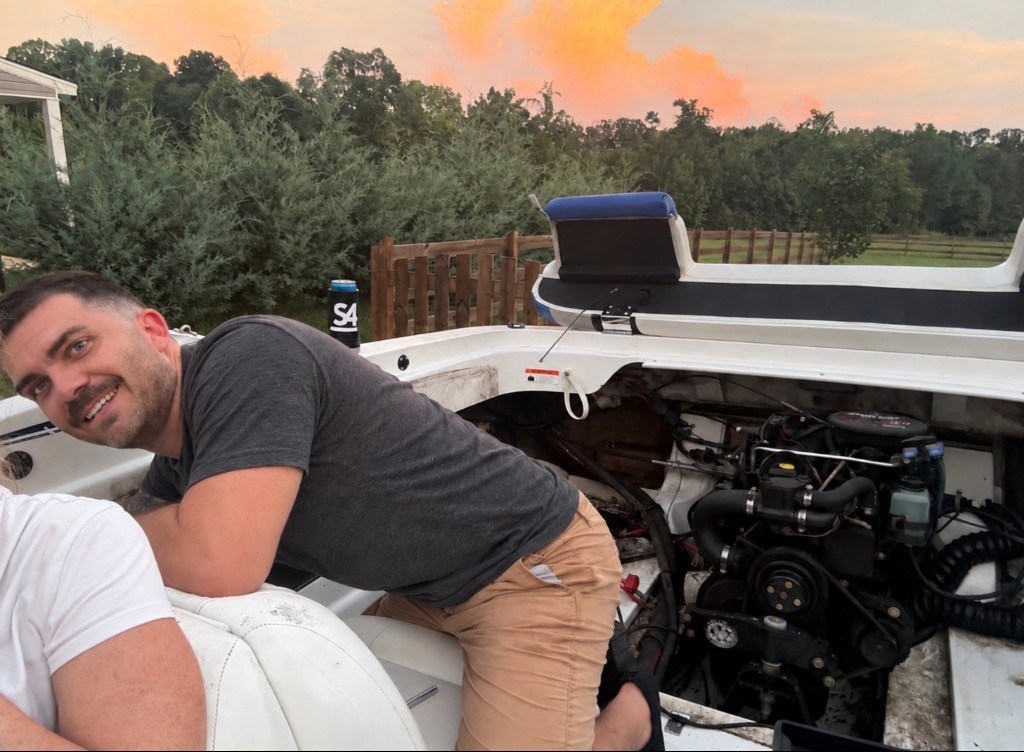 On the boat with the engine bay open.